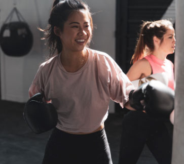 Gym 24/7 Richmond member in boxing class